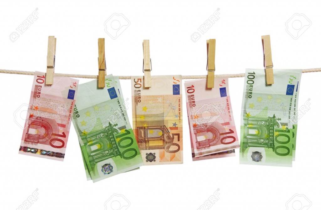 6774885-Money-laundering-on-clothesline-isolated-on-white-background--Stock-Photo